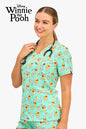 Disney’s Winnie the Pooh Women’s 3-Pocket Scrub Top, Easter Egg Hunt