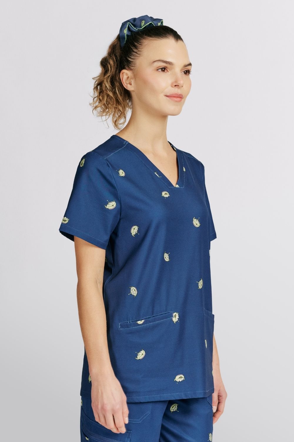 Disney & Pixar’s Toy Story Women’s 3-Pocket Scrub Top, Little Green Men