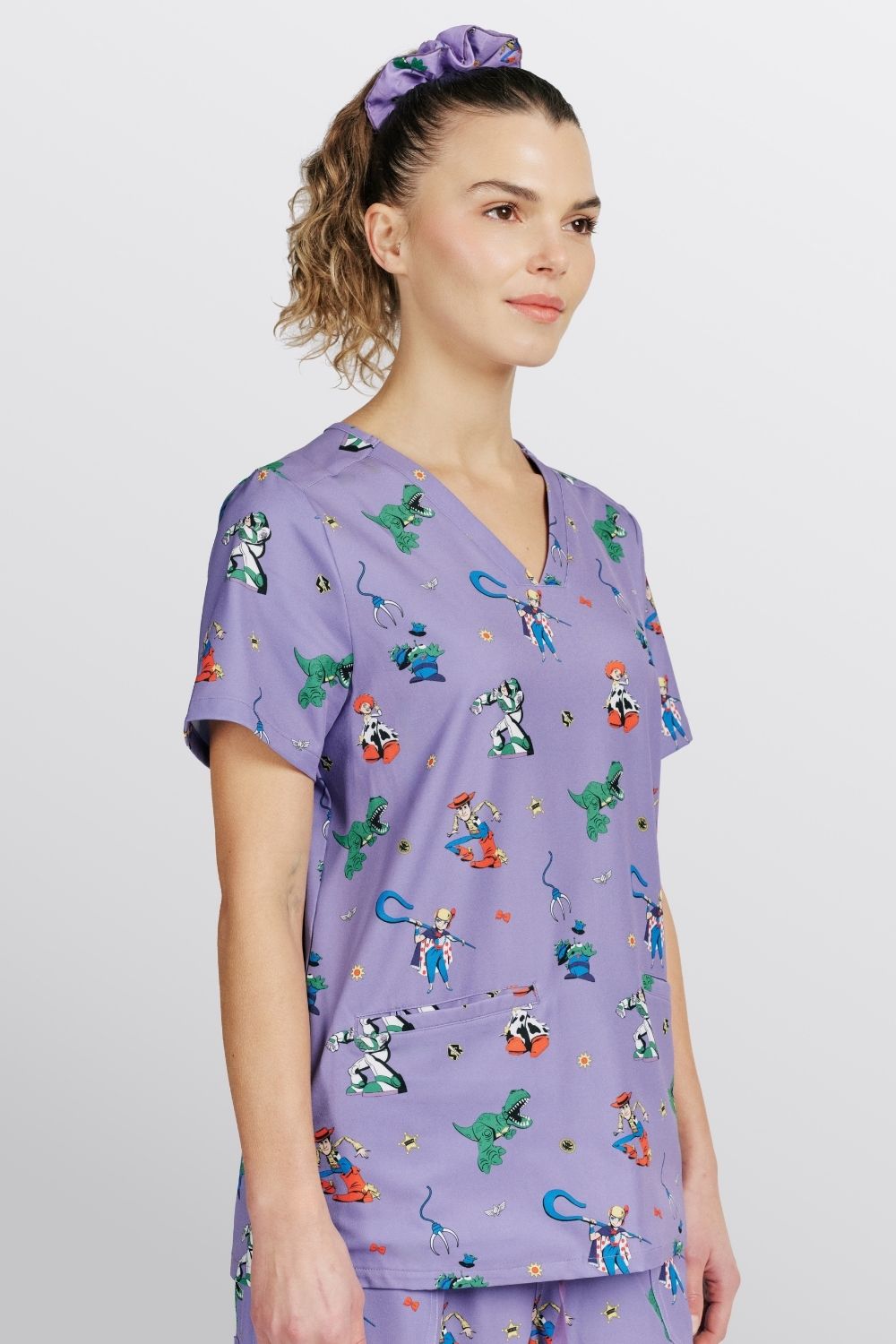 Disney & Pixar’s Toy Story Women’s 3-Pocket Scrub Top, You’ve got a Friend