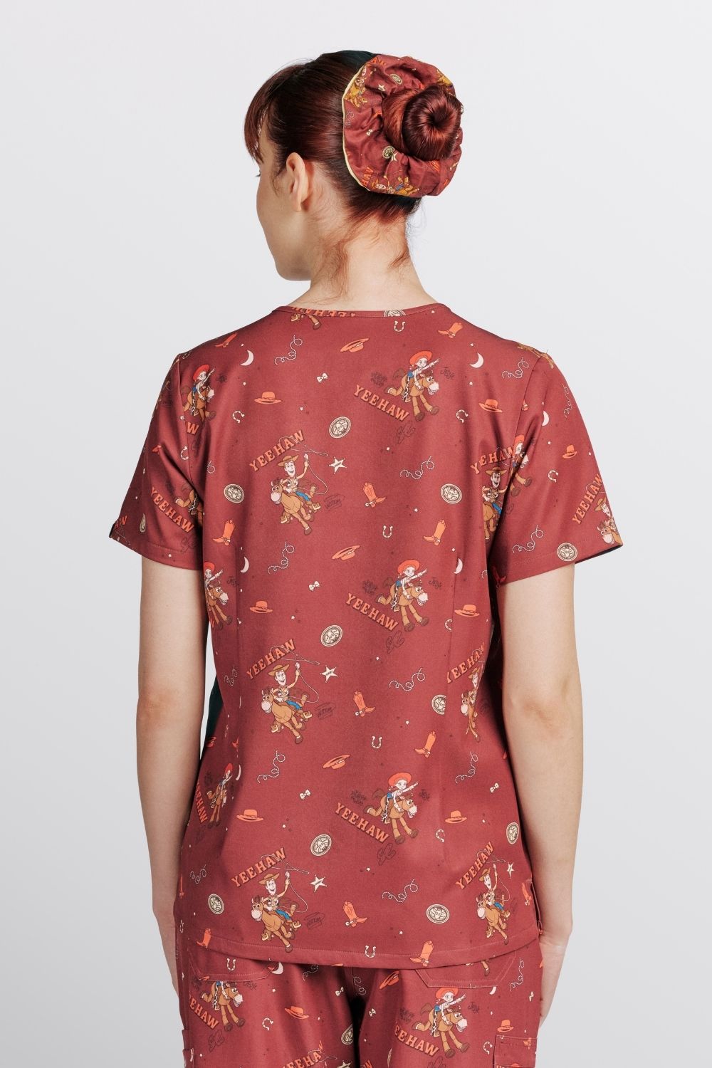 Disney & Pixar’s Toy Story Women’s 3-Pocket Scrub Top, Yeehaw