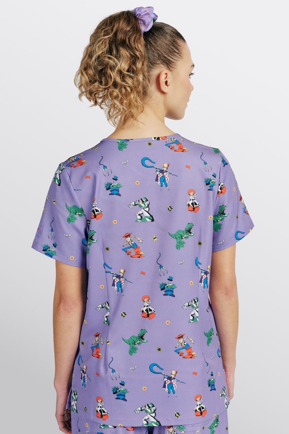Disney & Pixar’s Toy Story Women’s 3-Pocket Scrub Top, You’ve got a Friend