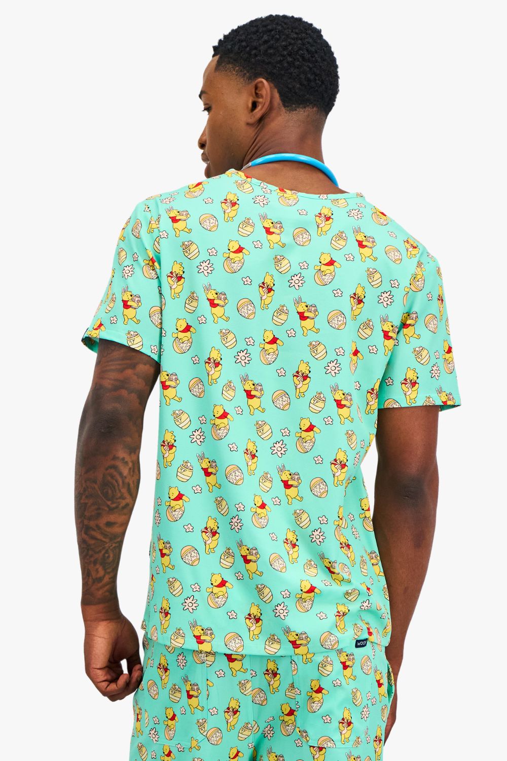 Disney’s Winnie the Pooh Men’s 3-Pocket Scrub Top, Easter Egg Hunt