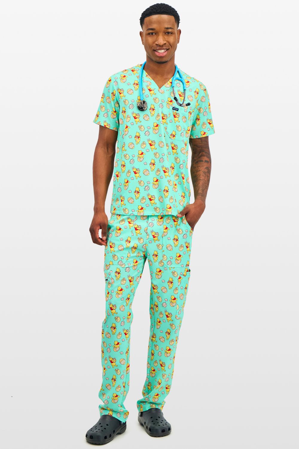 Disney’s Winnie the Pooh Men’s 3-Pocket Scrub Top, Easter Egg Hunt