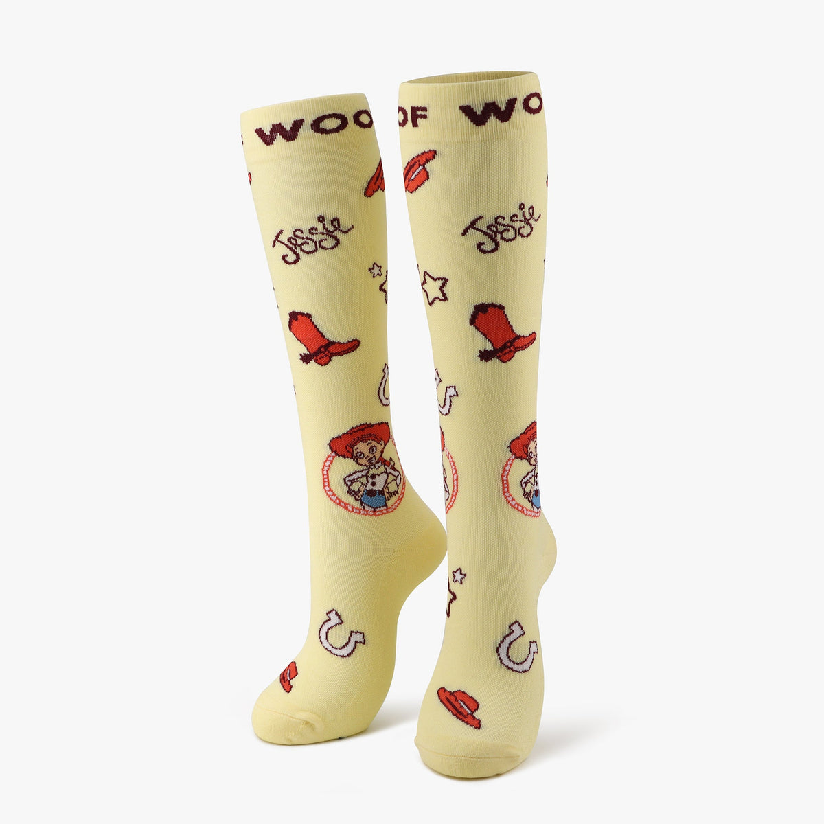 A pair of pale yellow compression socks featuring Jessie from Disney and Pixar’s Toy Story. 