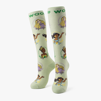 Side-by-side standing display of the mint green Disney Princess character portrait knee-high compression socks featuring Rapunzel, Tiana, Moana, and Cinderella.