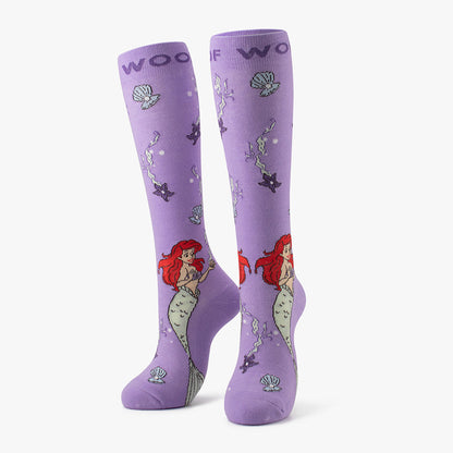 Side-by-side standing display of the purple Little Mermaid / Ariel Disney Princess knee-high compression socks.