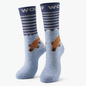 Pair of blue bamboo crew compression socks with platypus design standing against a plain white background.